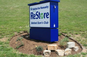 ReStore sign, rock and flower landscaping