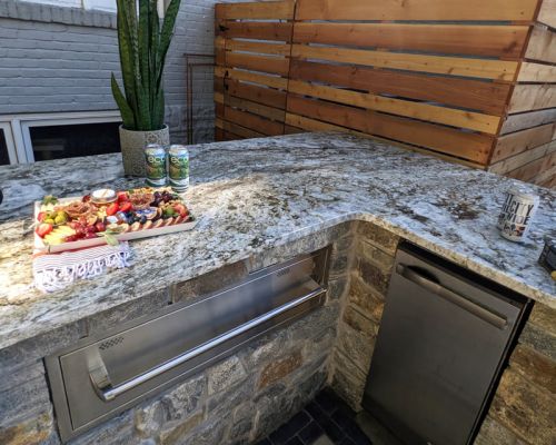 Warming tray and outdoor refridgerator with unilock pavers